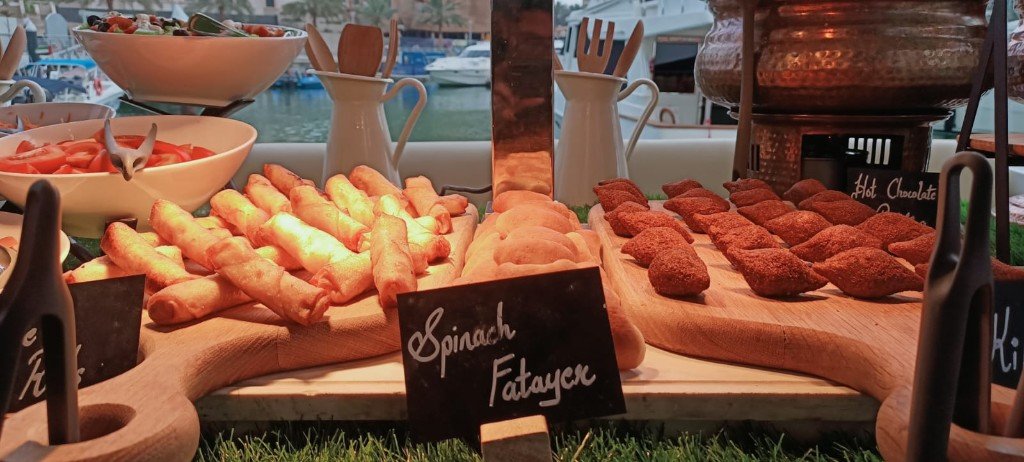 Spinach fatayer, kibbeh and spring rolls on a yacht buffet
