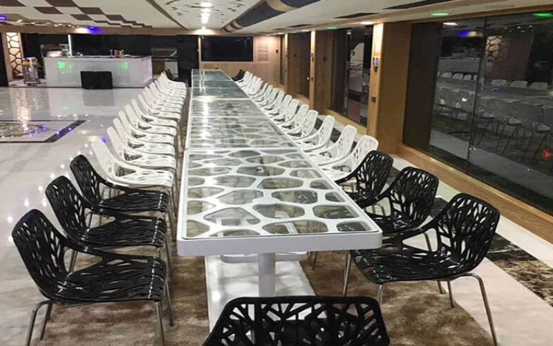 "Spacious dining area inside Lotus Mega Yacht, a top choice for yacht rental in Dubai by Mala Yachts."