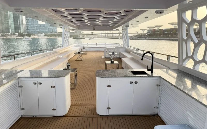 Polished interior lounge with panoramic windows – relax in refined surroundings with yacht rental Dubai by Mala Yachts