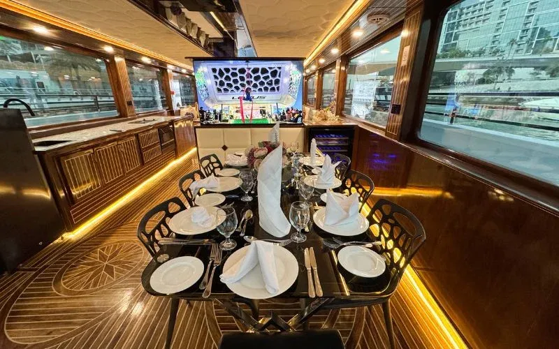 Polished interior lounge with panoramic windows – relax in refined surroundings with yacht rental Dubai by Mala Yachts