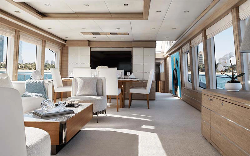 Elegant dining setup on Haigan 90ft yacht with stylish table arrangement – ideal for private dinners via Mala Yachts’ yacht rental in Dubai