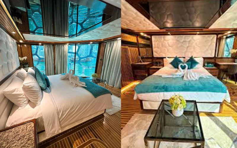 Cozy bedroom on Orchid Yacht with large bed, soft lighting, and sea-view window