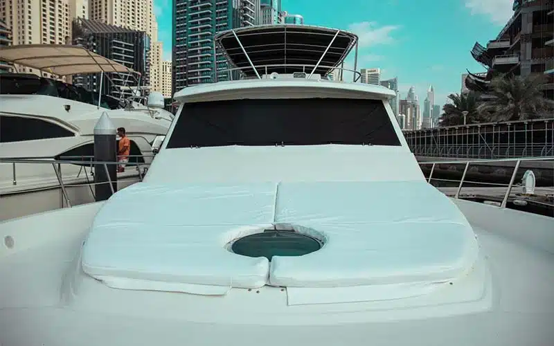 Top view of Gulf King Yacht showing open flybridge with sunbeds, lounge area, and captain’s helm station