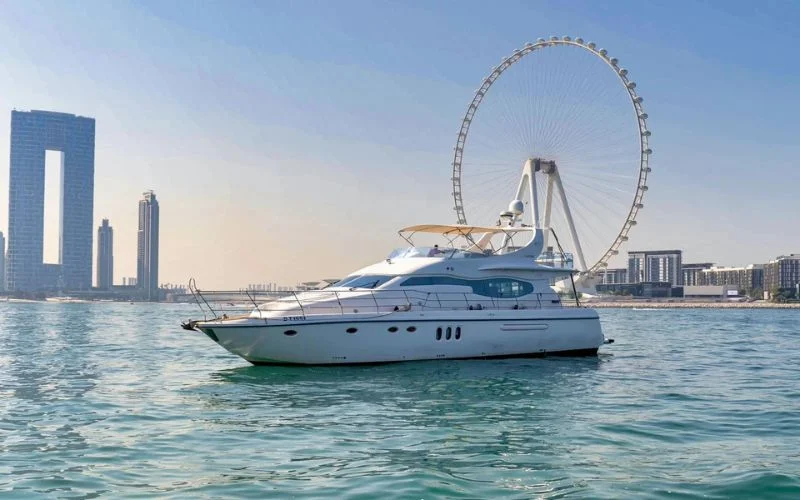 Mayas Yacht anchored near the coastline with luxury profile visible