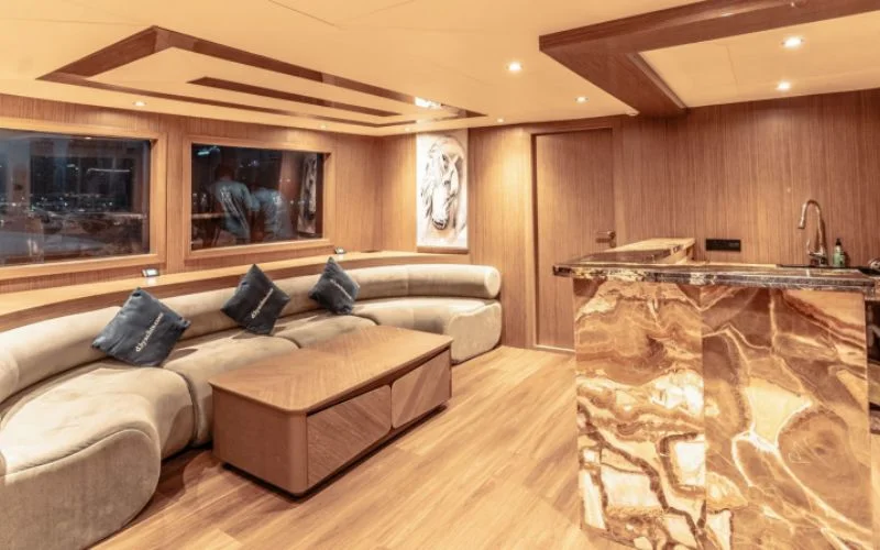 Interior cabin with warm lighting, wooden finish, and modern design inside D3 33 Yacht