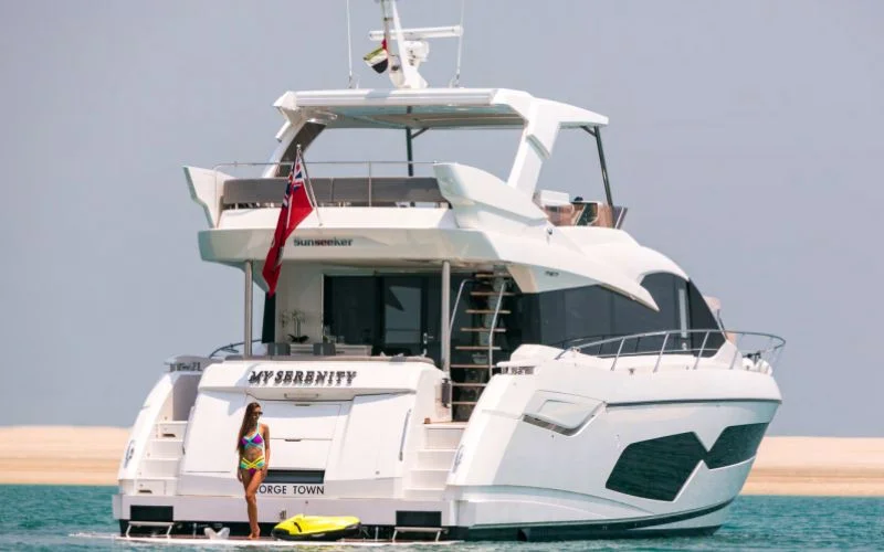"Stylish exterior of My Serenity yacht under clear Dubai skies – Mala Yachts premium yacht rental Dubai experience"