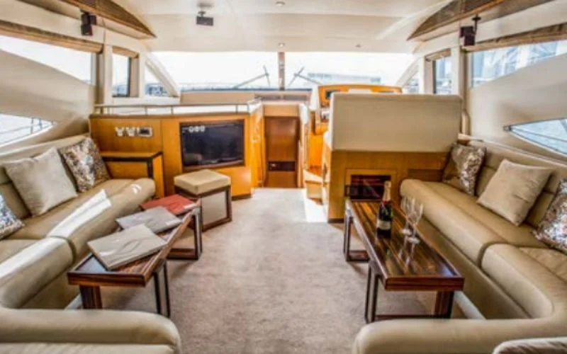 "Spacious lounge area inside Lagoona 56ft yacht – Mala Yachts luxury yacht rental in Dubai"