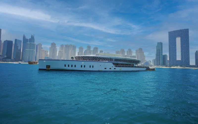 Side profile of Lotus Royale Yacht with sleek, multi-deck luxury design