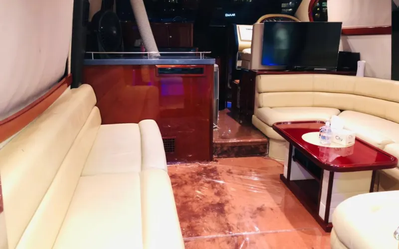 Compact yet stylish dining area with wood finish in Al Shali Yacht