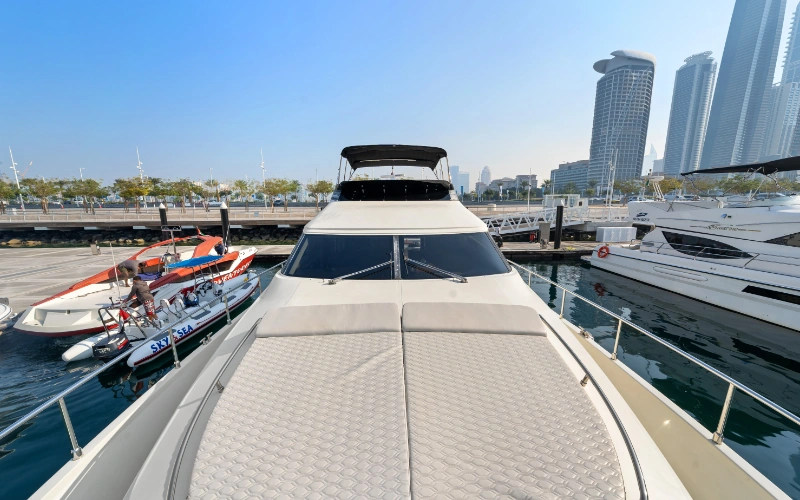 Stylish lounge area inside the Gulf Craft 60ft yacht featuring plush seating and ambient lighting – enjoy unmatched comfort with Mala Yachts’ yacht rental in Dubai.
