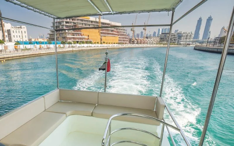 Sunroof feature in the lounge area of the Riverside yacht allowing natural light and sea breeze – enjoy airy luxury with Mala Yachts’ yacht rental in Dubai.