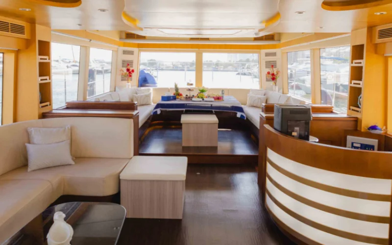 "Elegant dining and seating area inside Explora 60ft yacht – Mala Yachts premium yacht rental Dubai"