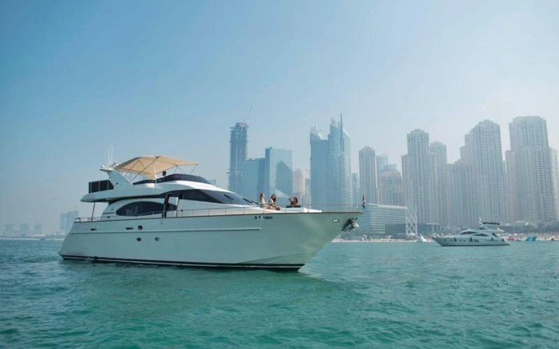 Luxury yacht cruising near Dubai Marina skyline – Mala Yachts offers premium yacht rental Dubai experiences.