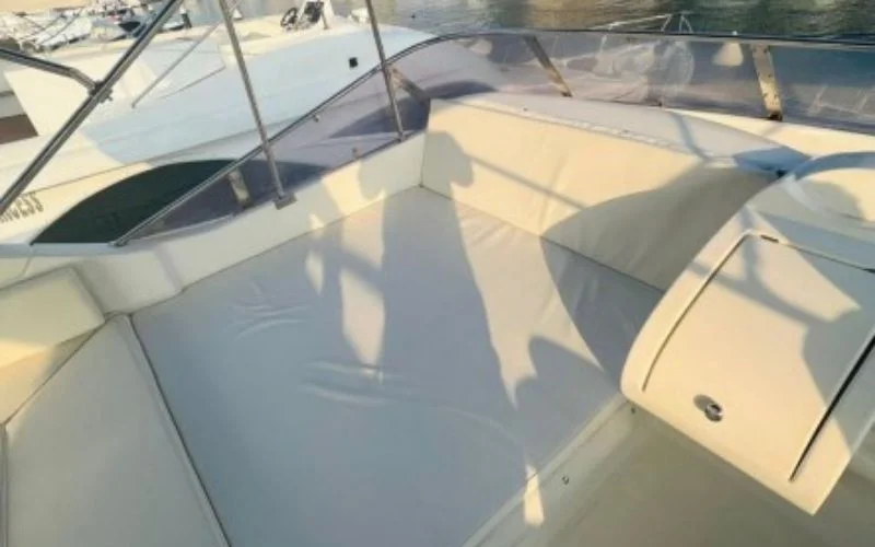 Panoramic salon interior aboard Majesty 70ft yacht offering stunning sea views and plush lounge seating – elevate your escape with yacht rental in Dubai by Mala Yachts.