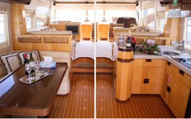 Modern interior lounge of the Vassia yacht with soft lighting and luxurious finishes – Mala Yachts offers premium yacht rental in Dubai for elegant cruising experiences.