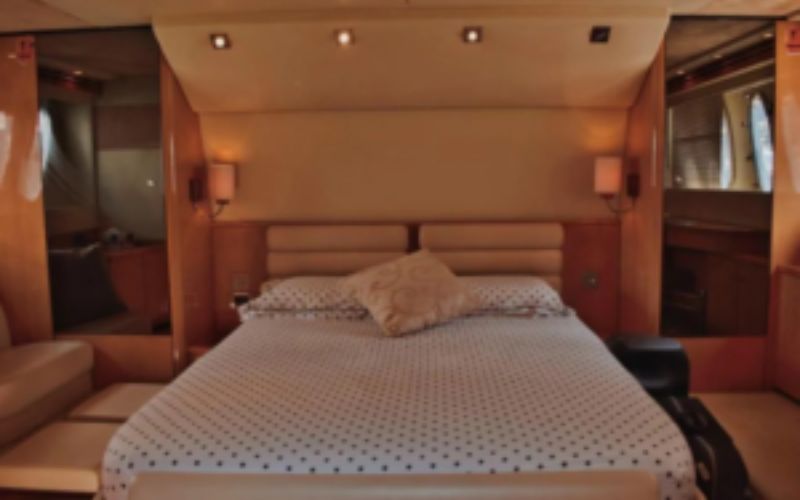 Master bedroom on Azimut 81 yacht with premium bedding and sea views – yacht rental in Dubai by Mala Yachts