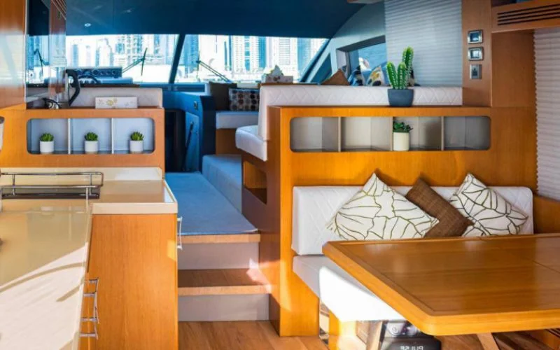 "Spacious indoor dining area aboard Majesty 48 yacht – Mala Yachts yacht rental Dubai service"