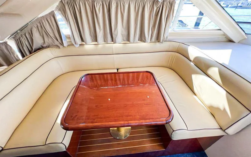 Plush sofa seating inside Fairline yacht – yacht rental in Dubai | Mala Yachts