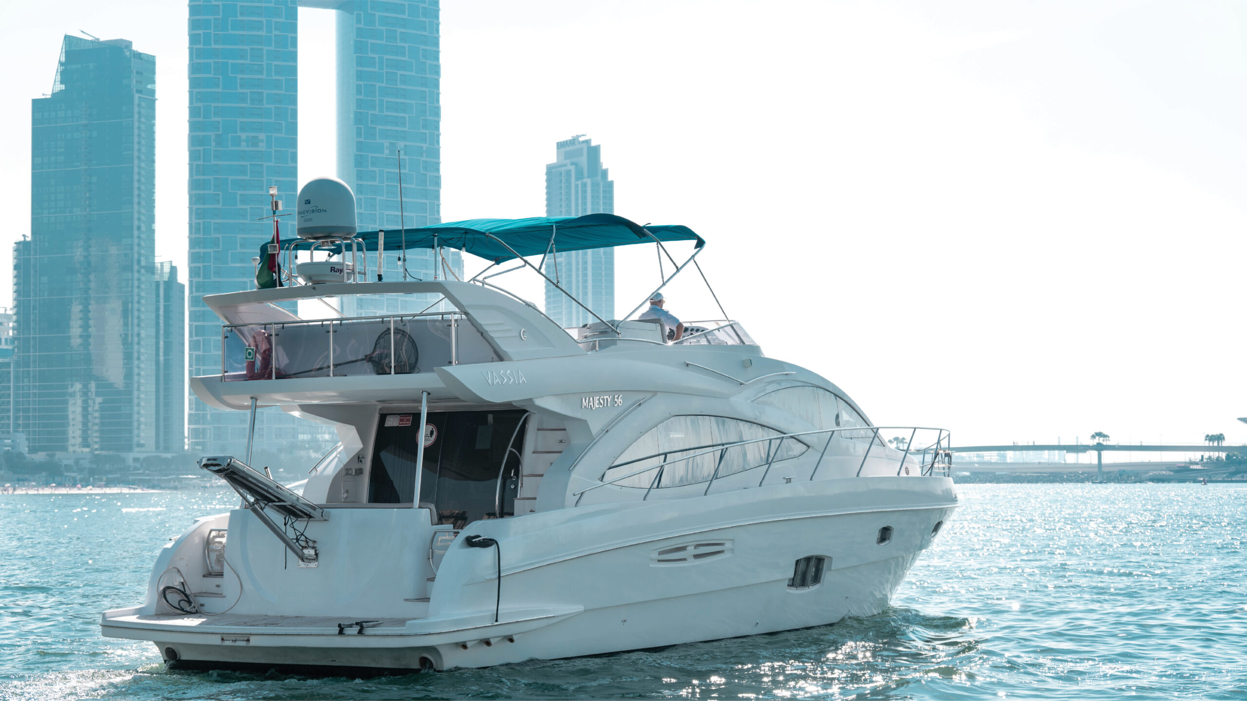 Vassia yacht cruising near the iconic Dubai skyline – Mala Yachts offers luxurious yacht rental in Dubai for unforgettable sea experiences.