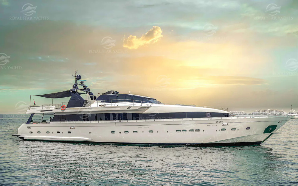 Luxury superyacht cruising on open sea at sunset with elegant modern design