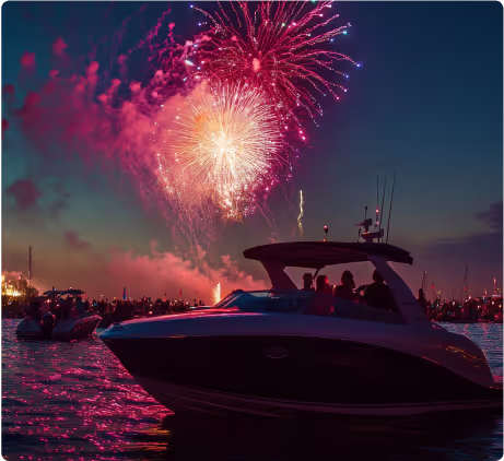 Luxury yacht with guests enjoying a fireworks display over Dubai waters during a night celebration.