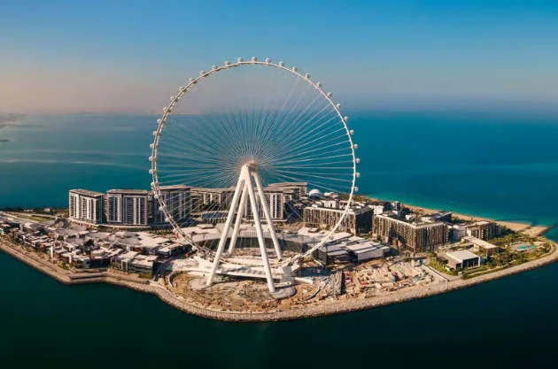 Ain Dubai and Bluewaters Island from the water Aerial view of Ain Dubai observation wheel on Bluewaters Island along a Dubai yacht cruise route