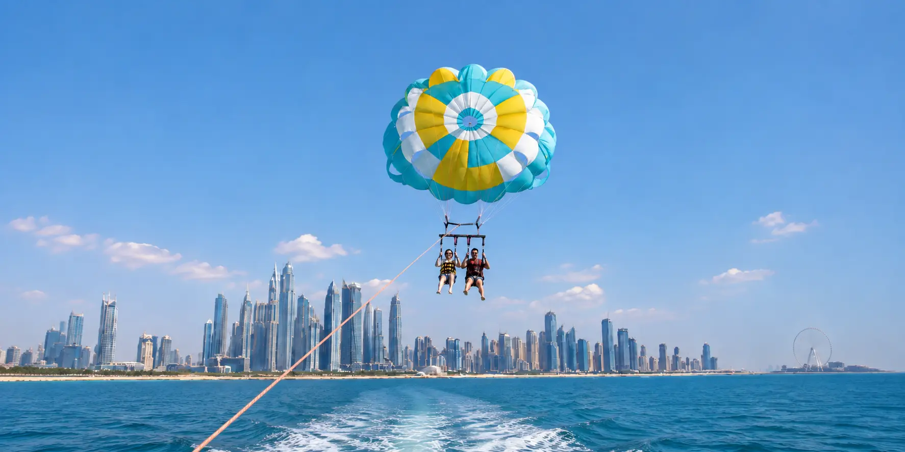 Parasailing above Dubai coastline with Mala Yachts